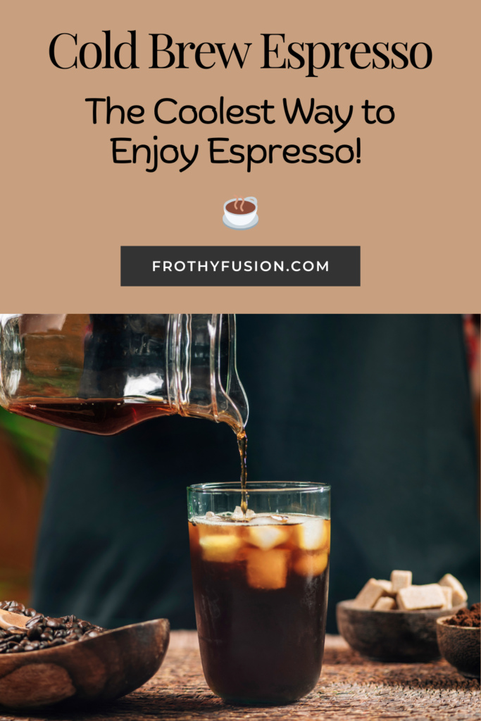 A glass of cold brew espresso with ice cubes, topped with creamy foam, placed on a rustic wooden table. Text overlay reads: ‘Cold Brew Espresso.’