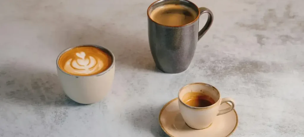 Cappuccino vs Flat White vs Latte - Which Coffee Is Actually Best? 4 Cappuccino vs flat white vs latte all served in natural cups, showing differences in milk foam and espresso