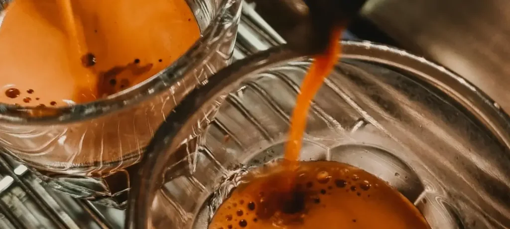 Perfect Espresso Shot - Step by Step Guide for Home Baristas 109 Perfect espresso shot being extracted into a glass with golden crema