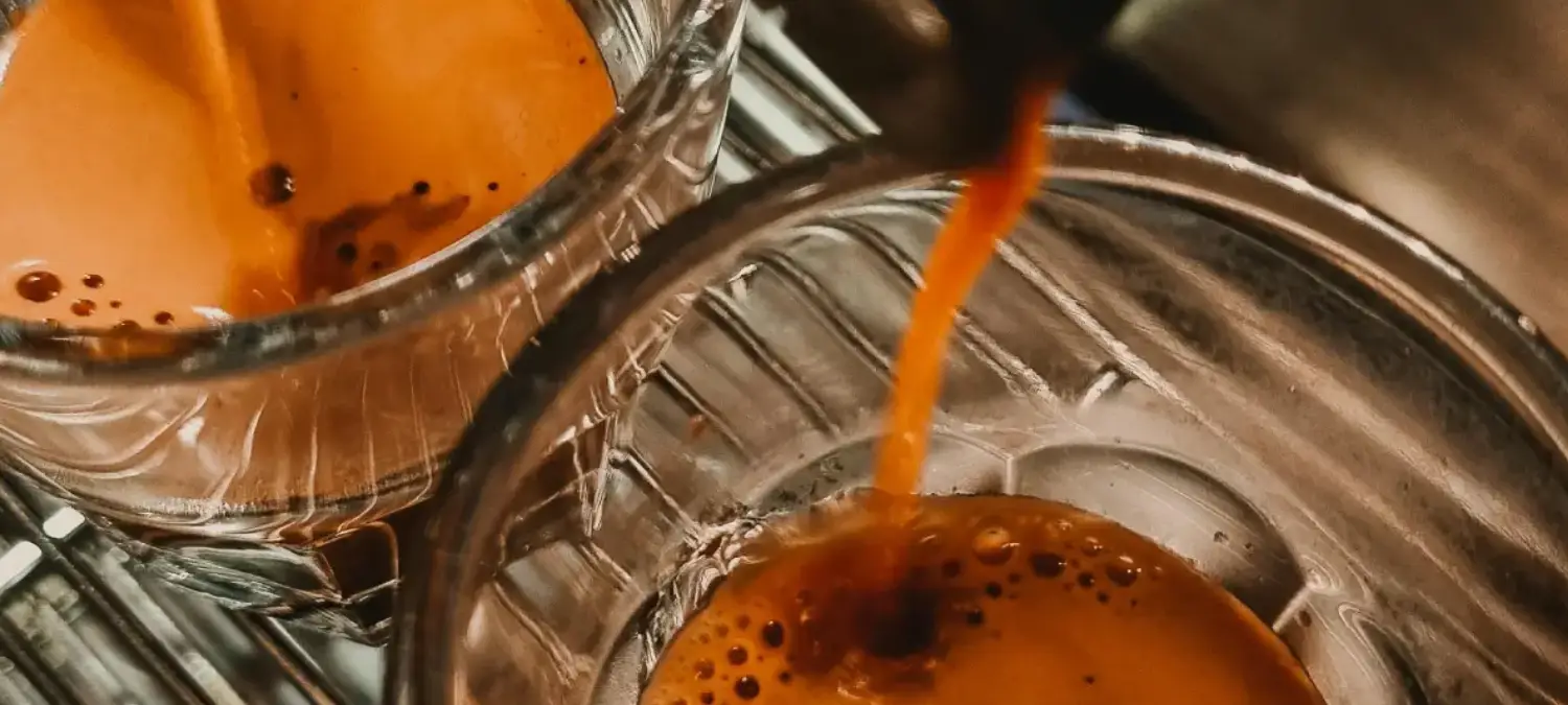 Perfect Espresso Shot - Step by Step Guide for Home Baristas 2 Perfect espresso shot being extracted into a glass with golden crema