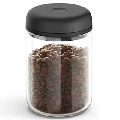 Fellow Atmos Vacuum Coffee Canister: Preserving Freshness, One Click at a Time Fellow Atmos Vacuum Coffee Canister with a vacuum seal mechanism.
