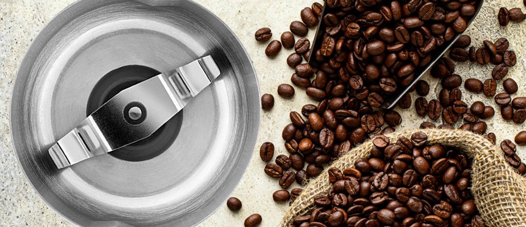 Close-up of Coffee Grinder Blades with Coffee Beans in the Background