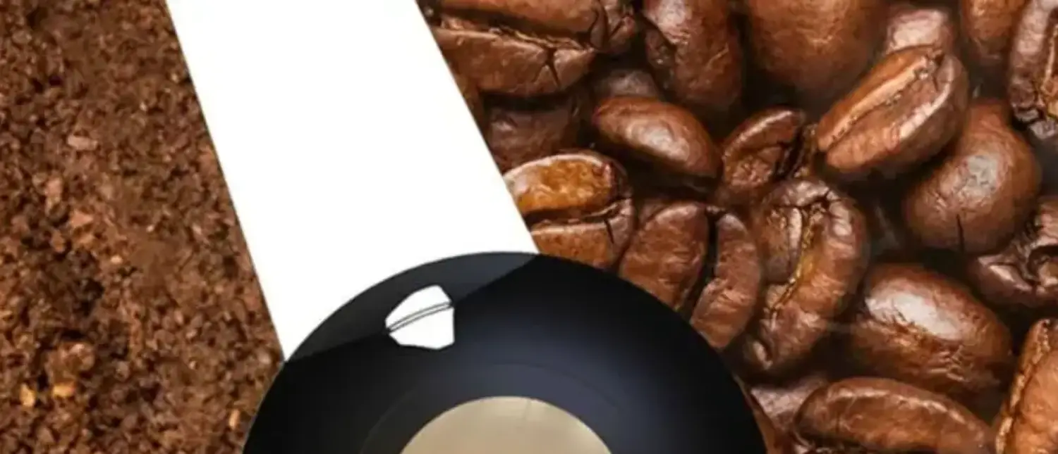 Blade Grinders: Are They Good for Coffee? ☕✨ 2 Close-up top view of a coffee blade grinder showing the blades inside the grinding chamber