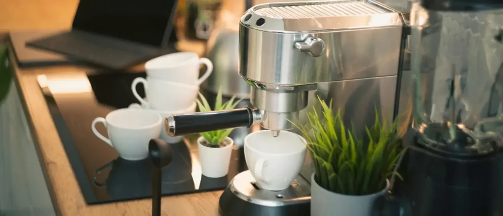 Pod Espresso Machines: Are Capsule Coffee Machines Worth It? ☕✨ 77 Pod espresso machine making coffee on a modern kitchen bench with espresso cups