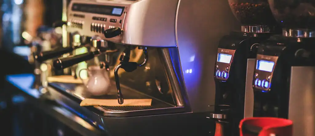 Close-up of a commercial espresso machine showcasing features for home coffee brewing