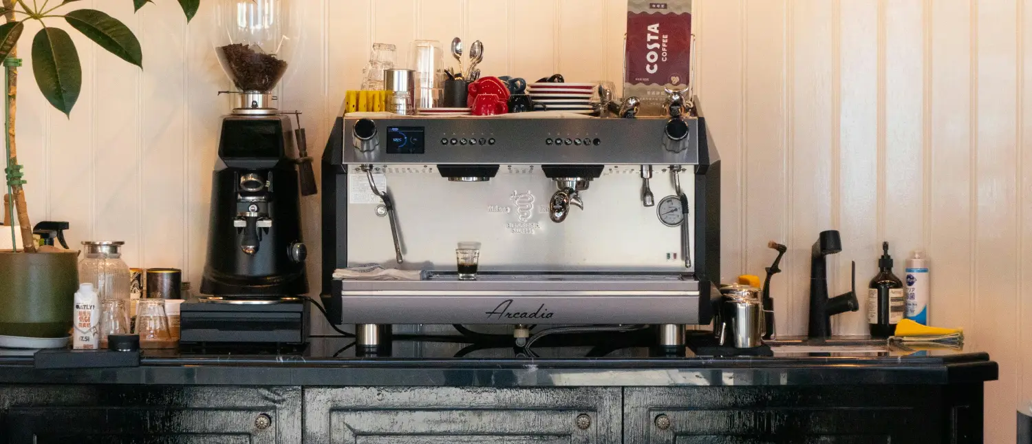 Coffee Station Ideas to Inspire Your Dream Setup ☕ 2 Coffee Station ideas for a neatly arranged home coffee station with espresso machine, grinder, and accessories on a countertop