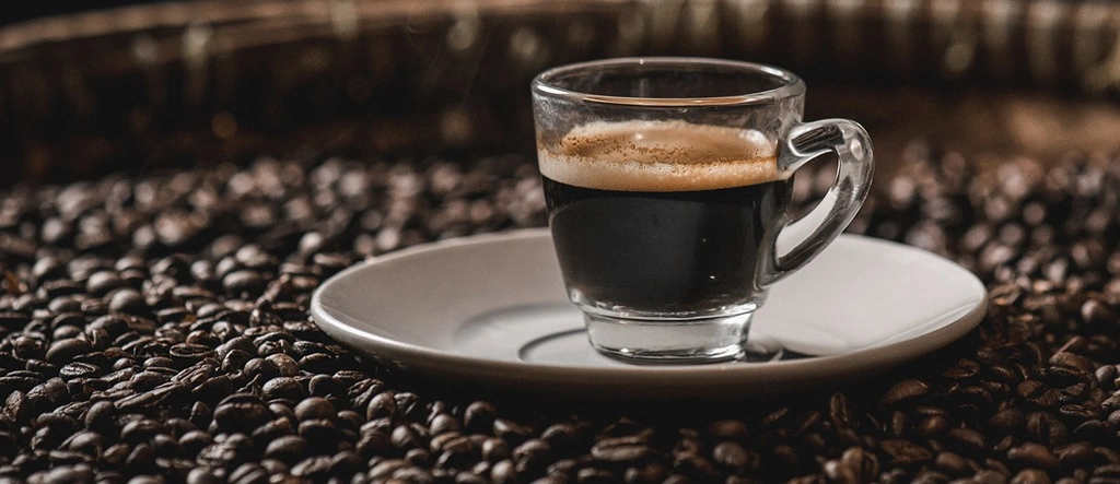 Perfectly formed crema on an espresso shot in a ceramic cup