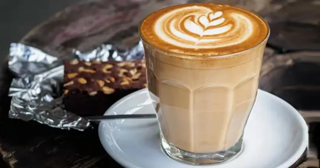 What Is a Latte? Complete Beginner's Guide (2026) 3 Creamy double shot latte in a glass with delicate latte art on top