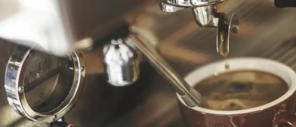 Espresso Machine Features: The Essential Guide for Better Espresso ☕✨ 55 Close-up view of espresso machine features highlighting its portafilter, steam wand, and control panel.
