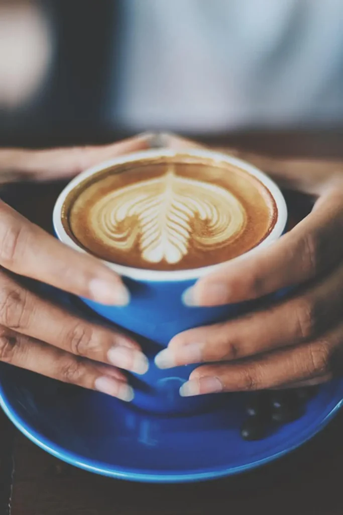 Rosetta latte art on a cup of coffee for beginner baristas