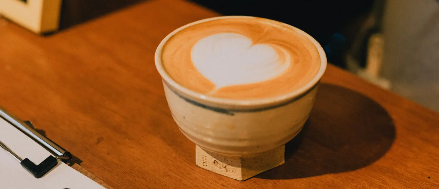 Heart Latte Art: How to Pour the Perfect Heart☕❤️ 2 Close-up of a latte topped with smooth milk foam and heart latte art