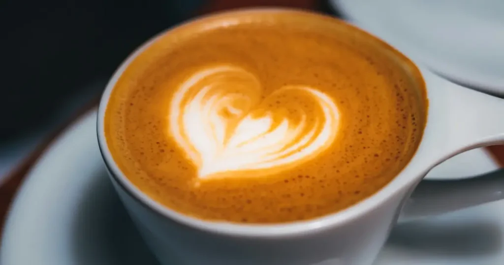 Heart Latte Art: How to Pour the Perfect Heart☕❤️ 4 A classic latte art design featuring a symmetrical heart shape created by carefully pouring steamed milk into espresso.