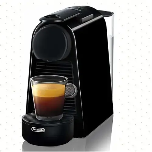 Nespresso Essenza Compact Espresso Machine Review Nespresso Essenza compact capsule espresso machine on a kitchen countertop ready to brew espresso coffee