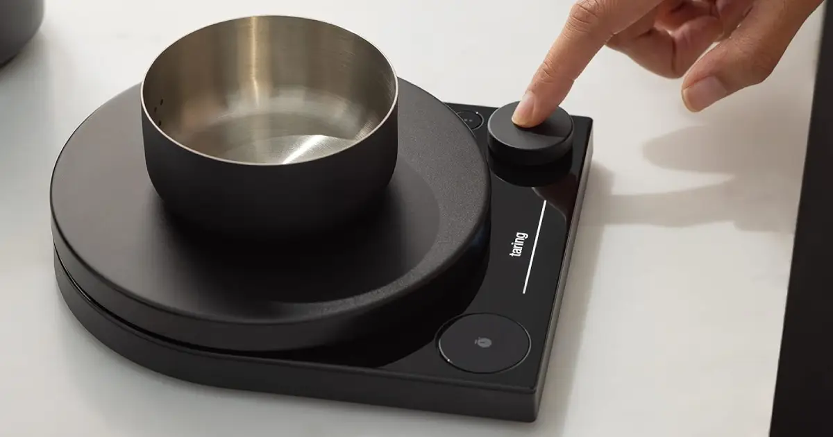 Fellow Digital Scale Review - Barista Grade Tool 2 Person using the Fellow Tally Pro Studio Digital Coffee Scale to measure coffee grounds during a pour-over brew