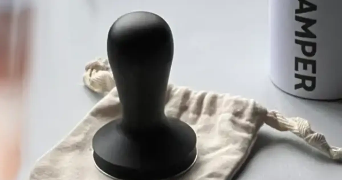 Barista Hustle Tamper Review – Lightweight, Precise, and Built for Speed 2 Barista Hustle coffee tamper with flat stainless steel base and ergonomic handle