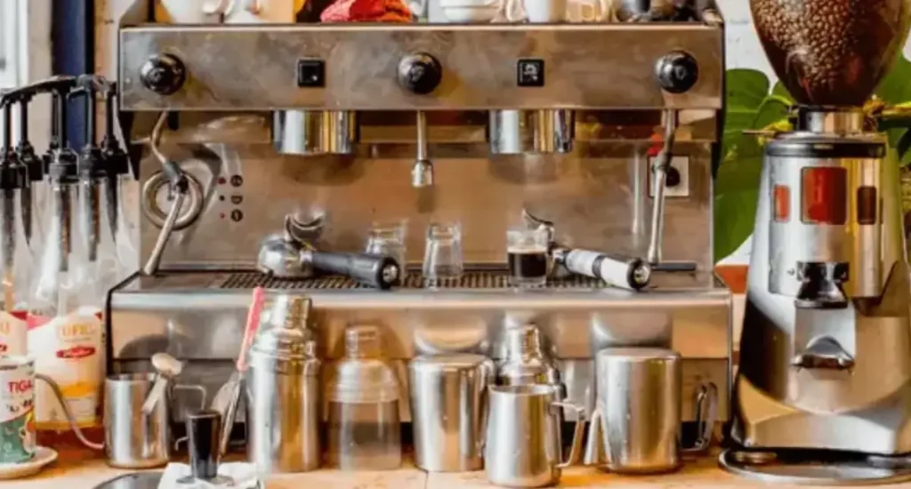 Best Budget Espresso Accessories Under $50 🧰 13 Assortment of budget-friendly espresso accessories on a coffee bar setup, including tamper, scale, and milk frother