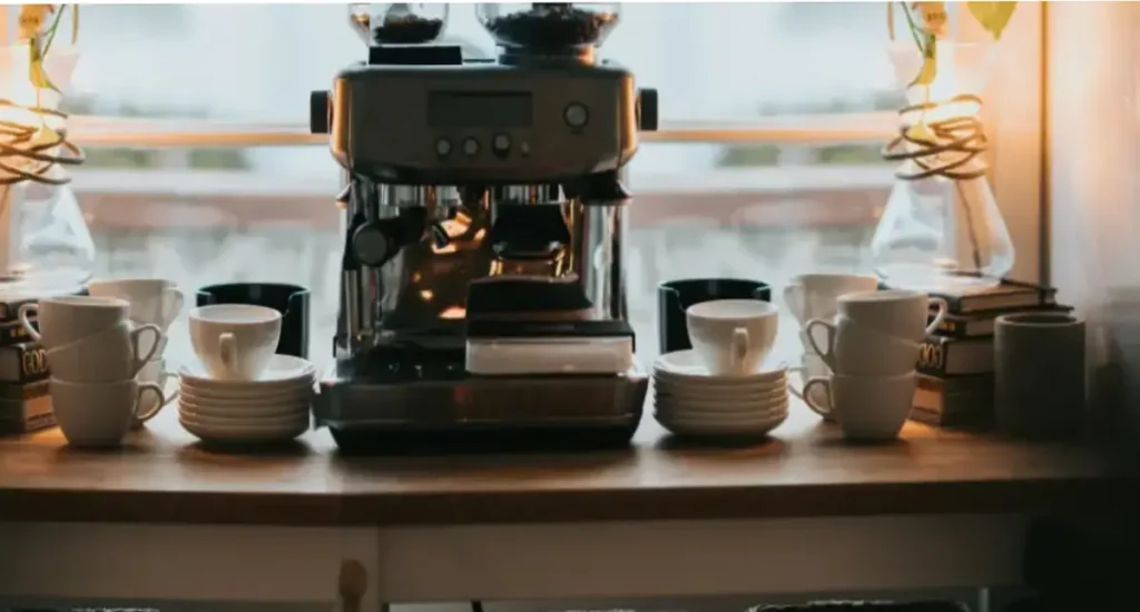 Best Compact Espresso Machines for Small Kitchens (2026) 1 Compact espresso machine placed on a table, perfect for small kitchens and spaces with limited counter area.