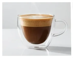 Popular Espresso Drinks Explained: A Beginner's Guide 11 A cortado in a short glass showing the espresso and milk ratio.