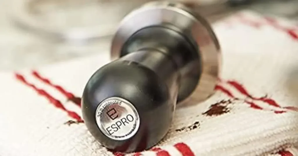 Espro Tamper Review – Perfect Pressure Every Time 24 Espro Calibrated Tamper with stainless steel base and ergonomic handle on espresso bar