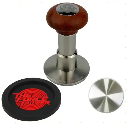 Force Tamper β Spring-Loaded Precision for Even Espresso Tamping Calibrated force tamper on a portafilter with espresso grounds