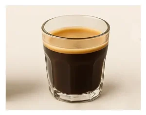 Triple Shot Americano: Caffeine & Taste Guide☕ 4 An Americano in a clear glass mug showing the espresso-diluted layers.