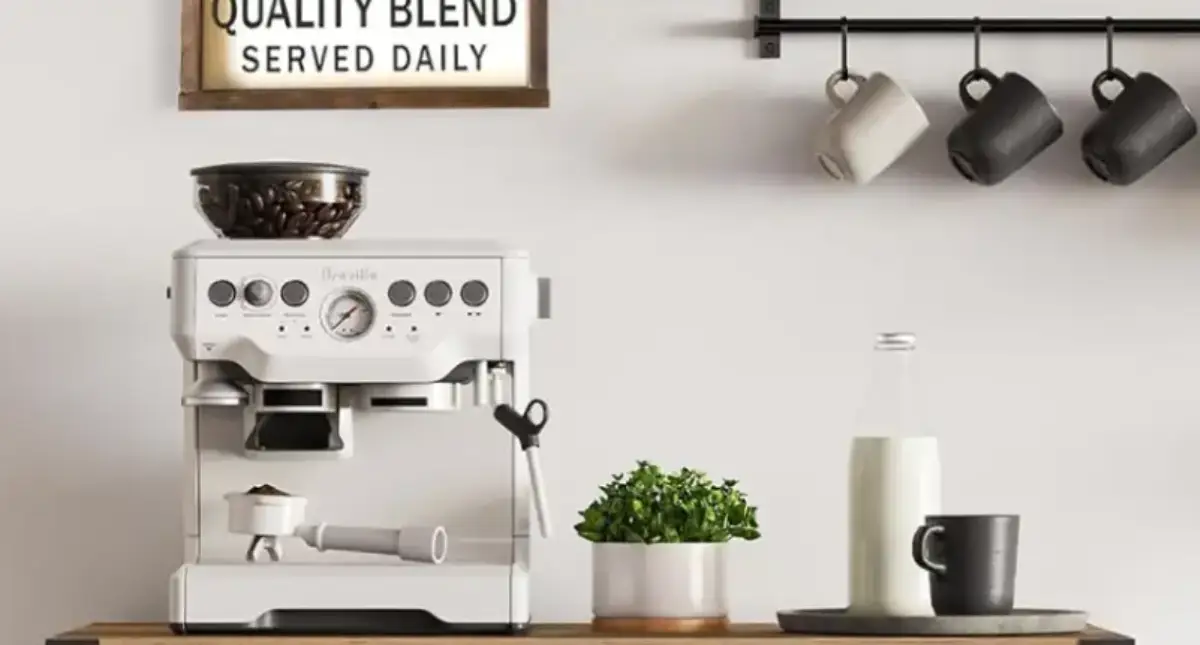 How to Set Up a Home Coffee Bar (Ideas & Gear Tips) 2 Stylish home coffee bar with espresso machine, cups, syrup bottles, and coffee storage