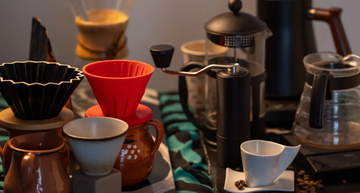 Coffee Gift Ideas for Espresso Lovers (Perfect for Every Occasion)π 2 Coffee glasses, espresso gear, and accessories displayed on shelves in a cozy home coffee bar