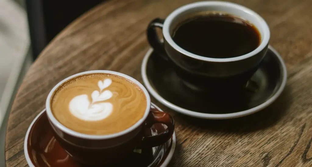Espresso vs Coffee – What’s the Big Difference?☕ 26 A cup of espresso and a mug of coffee side by side on a café table. Espresso vs coffee