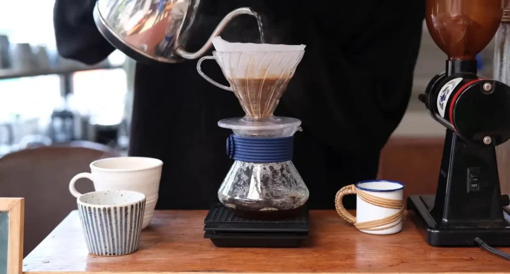 How to Brew Hario V60 Coffee Like a Pro ☕ 3 Person demonstrating How to Brew Hario V60 Coffee in an everyday setting