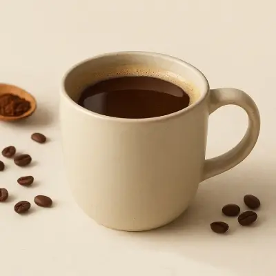 Functional Coffee – Boost Your Focus and Wellness with Adaptogens Cup of functional coffee surrounded by herbs, mushrooms, and adaptogenic roots on a wooden surface.