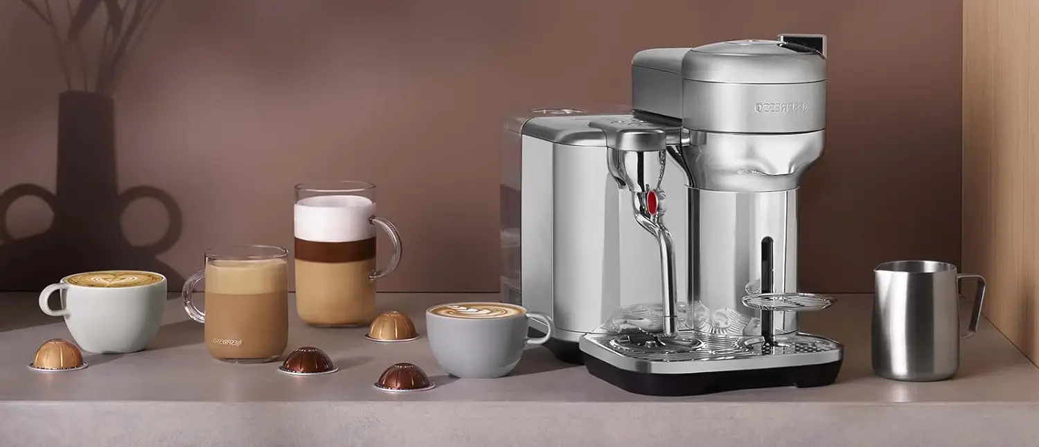 Nespresso Creatista Plus Review (2026): Worth It? 2 Nespresso Creatista Plus espresso machine on a kitchen bench with cups of coffee and milk