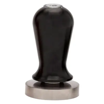 Espro Calibrated Tamper Review β Perfect Pressure for Every Espresso Shot | Frothy Fusion Hand using Espro Calibrated Tamper to press espresso grounds evenly into a portafilter on a countertop, representing perfect espresso tamping consistency.