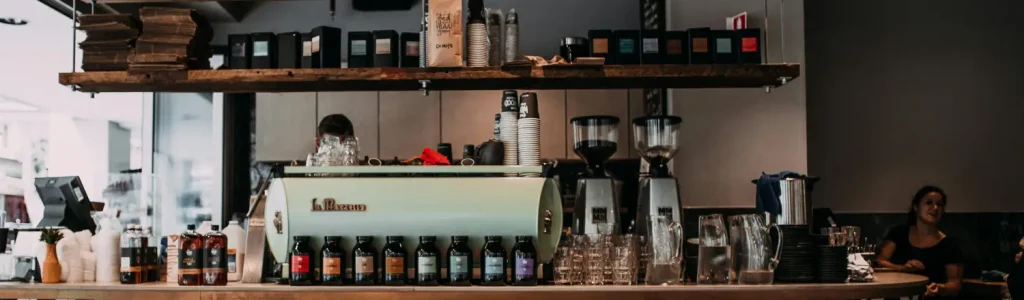 🛠️ 10 Must-Have Barista Tools for Your Home Coffee Bar 104 A cozy home coffee bar setup featuring espresso tools, machine, and accessories on a countertop