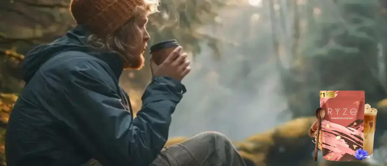 Ryze Chicory Coffee Review: A Smooth Low-Caffeine Coffee Alternative? 2 Man relaxing by a stream enjoying a cup of Ryze Chicory mushroom coffee with product pack visible in corner.