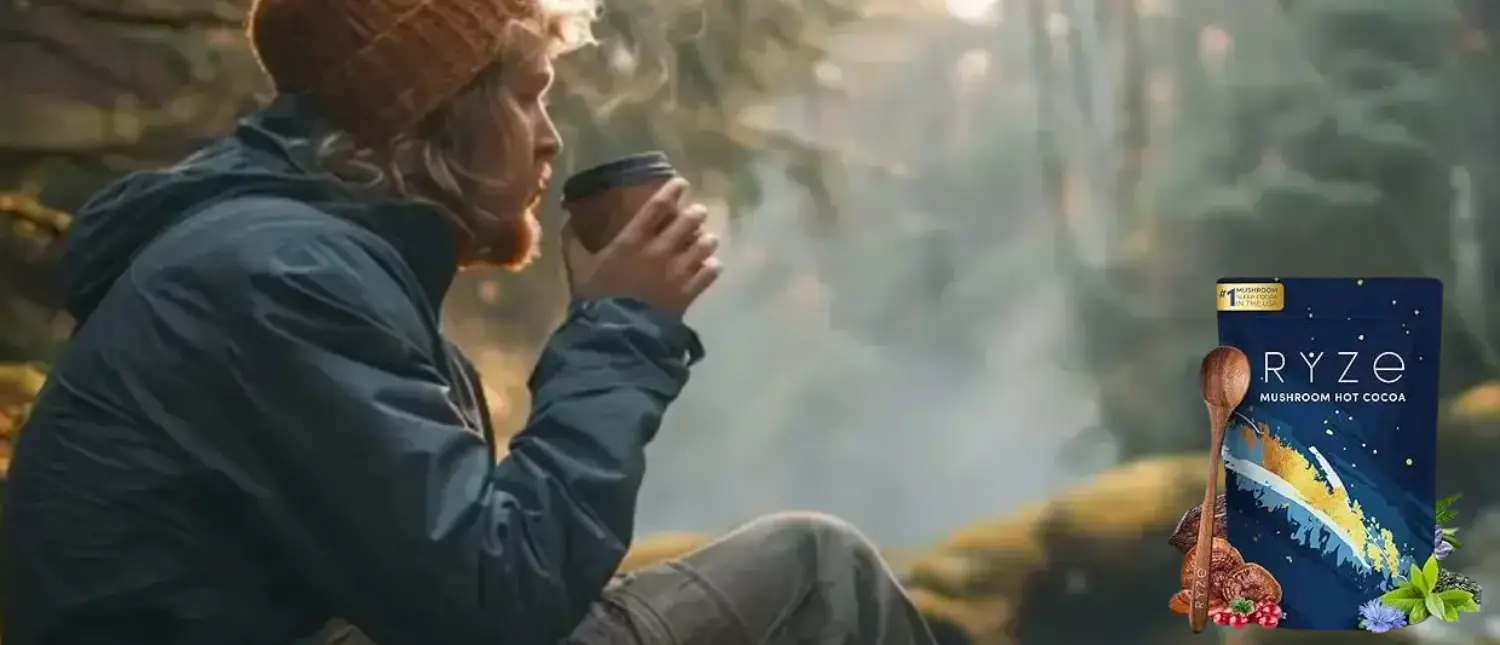 Ryze Cocoa Review: Is This Functional Hot Chocolate Worth Trying? 2 A warm cup of Ryze Cocoa mushroom coffee beside the product pouch on a rustic table, showing its rich chocolate color and cozy feel.