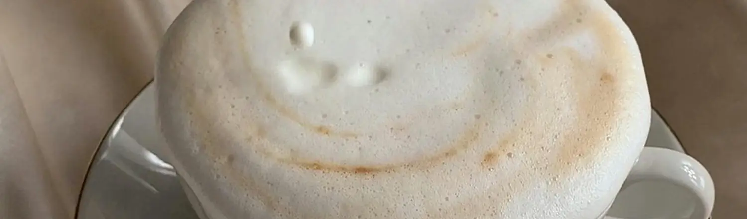 How to Froth Milk Without a Steam Wand 🥛✨ 2 Close-up of creamy sweet cream cold foam on top of iced coffee, Starbucks-style.