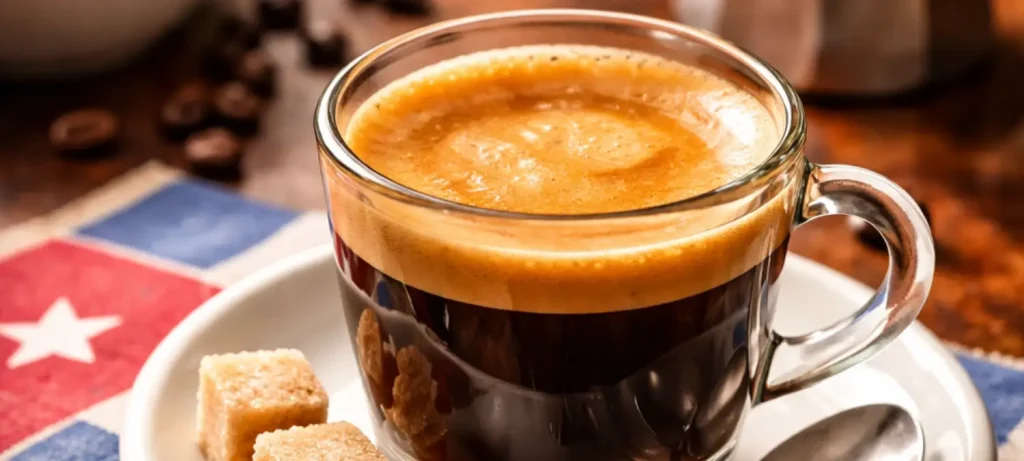 Cuban-Style Espresso Foam (Espuma) – Sweet, Creamy & Made Without Milk 🇨🇺 ☕✨ 19 Close up of Cuban coffee with sweet espuma foam on top