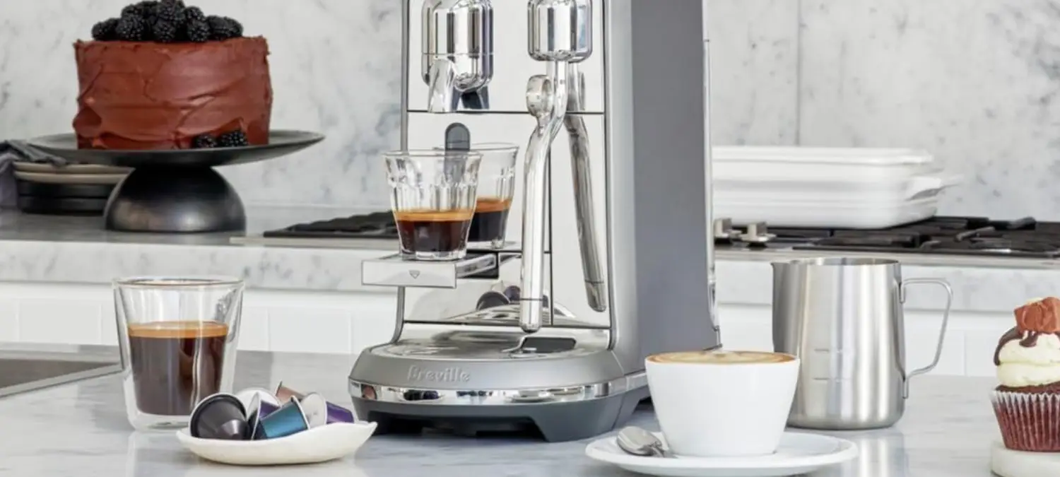 Best Capsule Coffee Machines: Find the Best One for You 2 Nespresso Vertuo coffee machine on kitchen bench with coffee cup and accessories