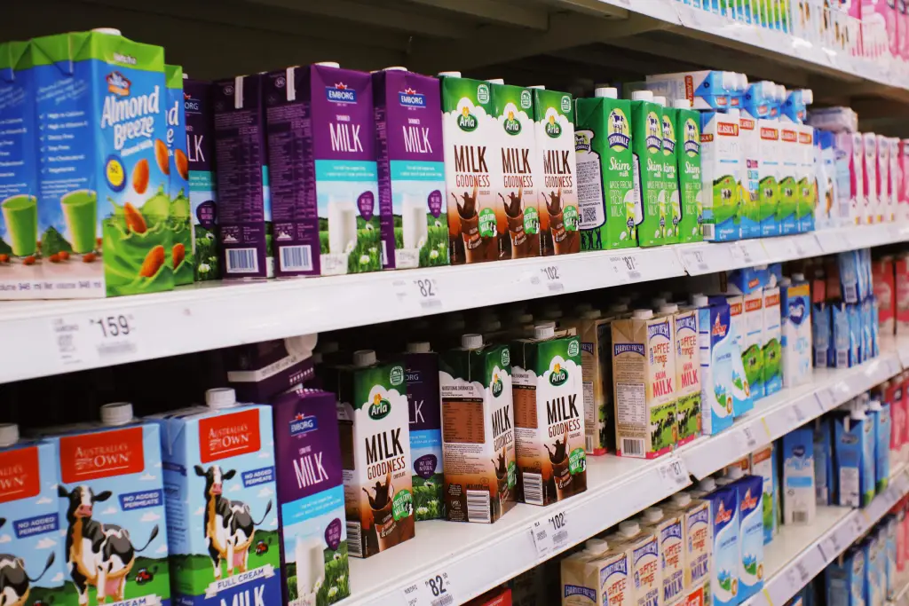 Milk Options for Matcha Lattes on Store Shelf Cartons of oat, almond, soy, and dairy milk on a shelf. Which one is the best milk for matcha lattes