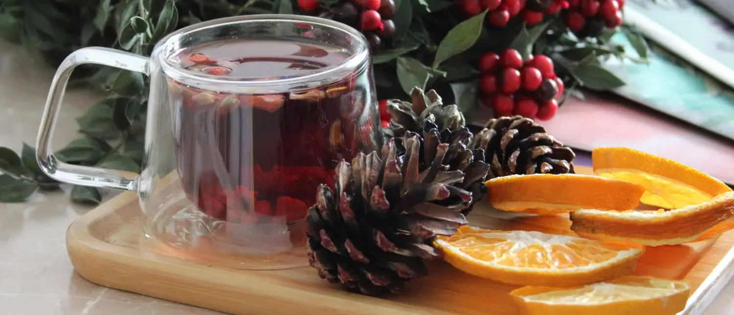 Explore Alternatives to Caffeine (Feel Energised) ☕ 2 Herbal tea on a tray with orange slices and natural decorations as a healthy caffeine alternative for natural energy