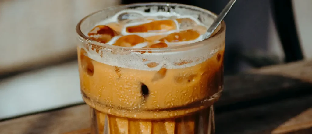 What Is Iced Coffee? Recipe, Taste & Caffeine Guide ☕❄️ 10 Close-up of a refreshing iced coffee served over ice in a glass.