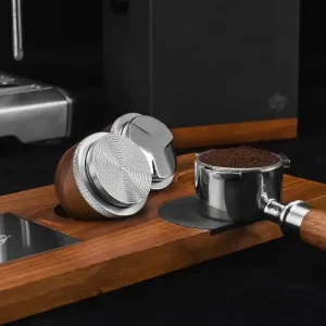 Espresso Distribution Tools: Are They Worth Buying? 5 Palm-style espresso distribution tool used to evenly level coffee grounds in a portafilter before tamping.
