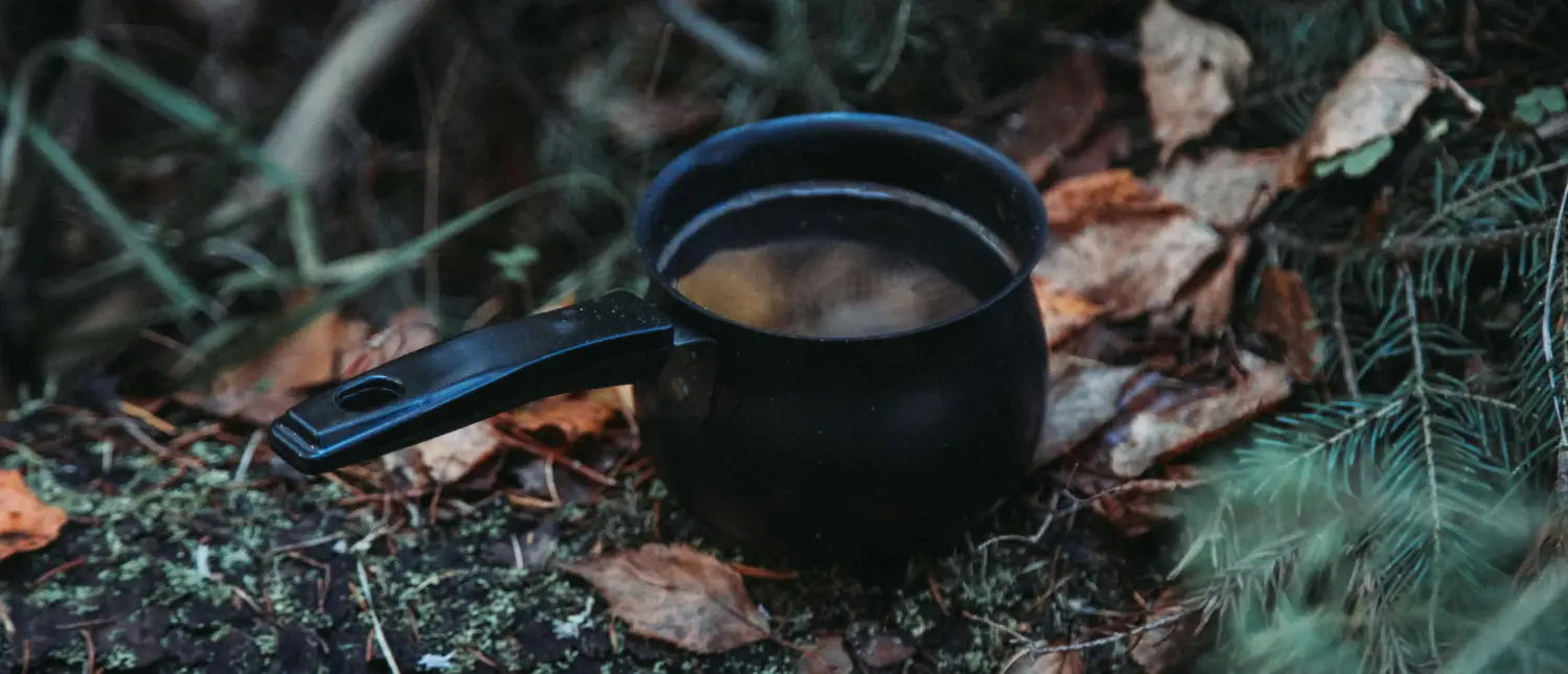 Ryze Chicory Coffee Benefits: Is It Worth Trying? 2 Cup of Ryze chicory coffee with chicory root and functional mushroom ingredients on a wooden table indicating Ryze Chicory Coffee benefits
