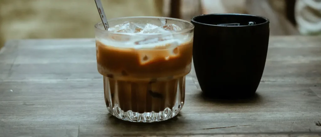 Triple Shot Iced Coffee: Caffeine & Taste Guide 7 Triple shot iced coffee served over ice in a glass on a wooden table