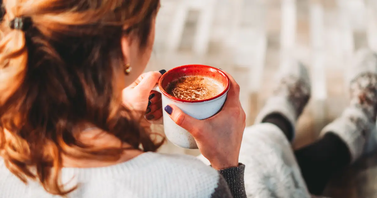 Best Mushroom Coffee Alternatives: 9 Great Options☕🍄 2 Two women enjoying coffee outdoors while exploring healthy mushroom coffee alternatives and functional drinks.